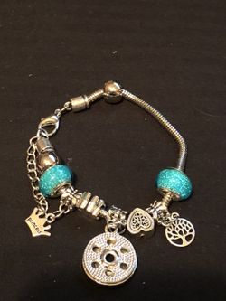 Women’s silver plated turquoise love charm bracelet 7/1/2 inch no refunds