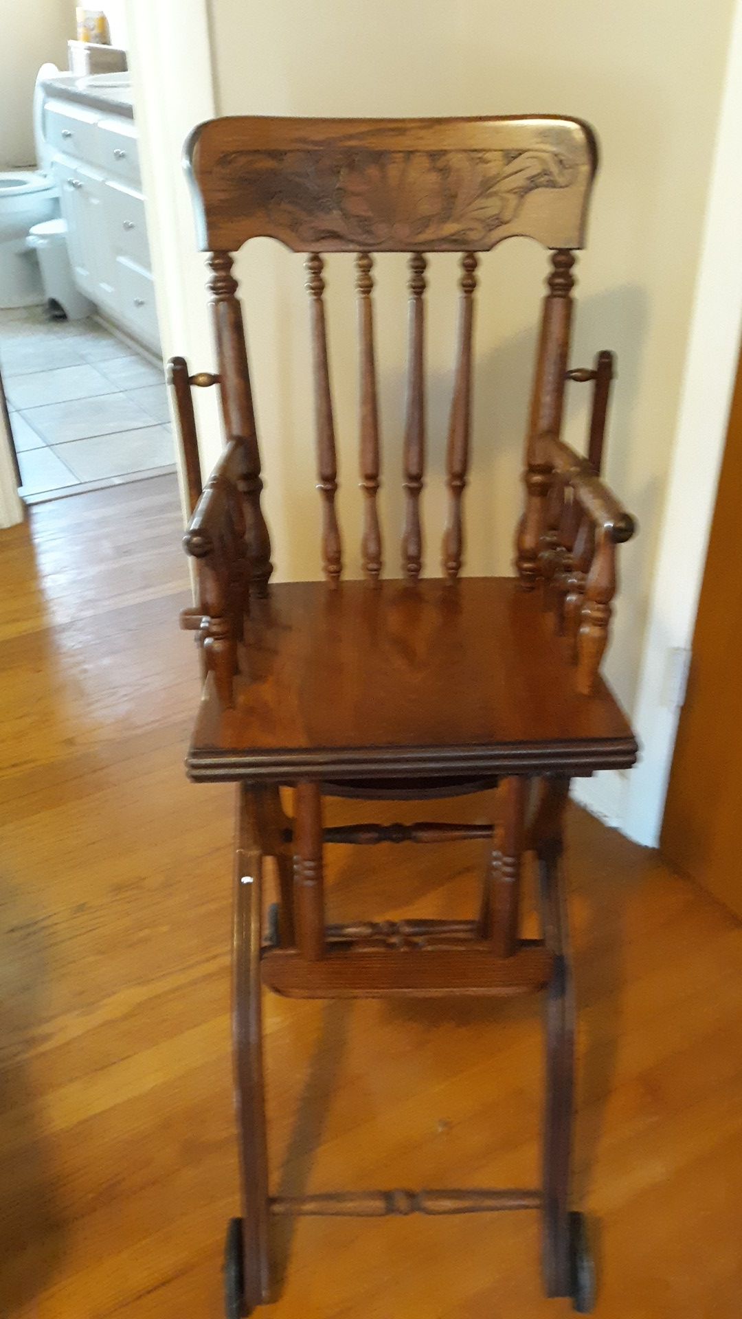 A wooden antique high chair
