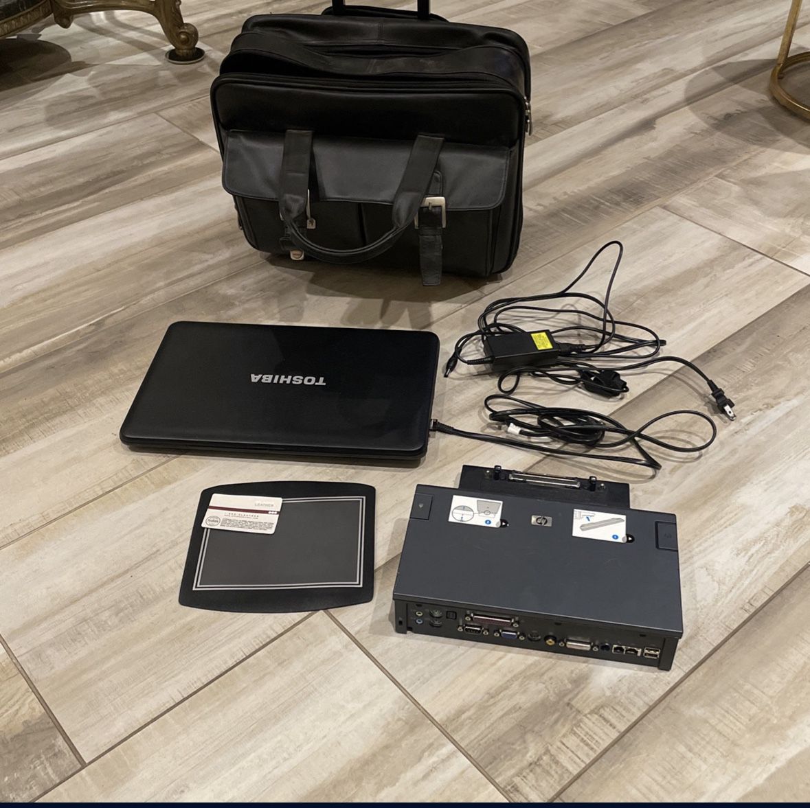 Toshiba Laptop with charger, Wilson Leather Business Bag, HP Docking Station, Mouse Pad.  