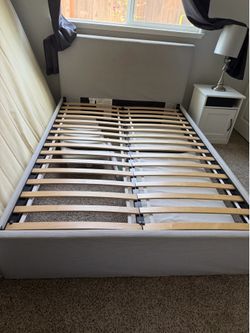 Modern upholstered full-size bed frame in great condition.