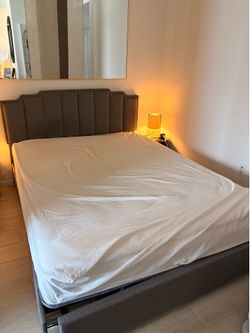 Grey queen bed frame with 2 storage drawers