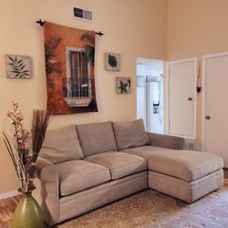 Light beige fabric sectional sofa with a left-facing chaise