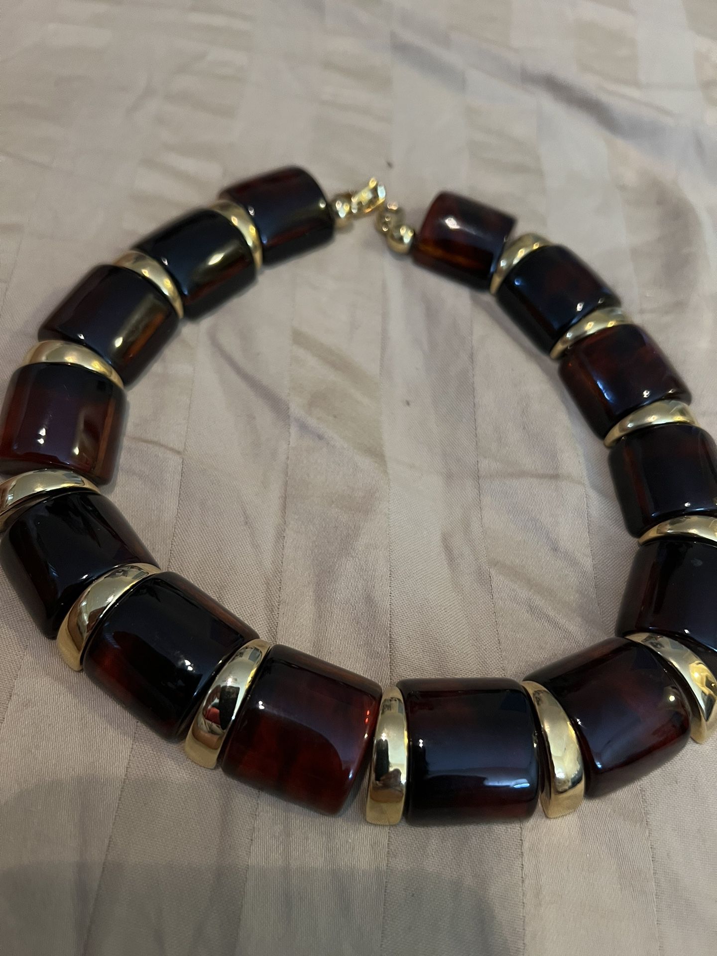 Napier lucite mock tortoise, amber necklace with gold spacers circa 1970s 