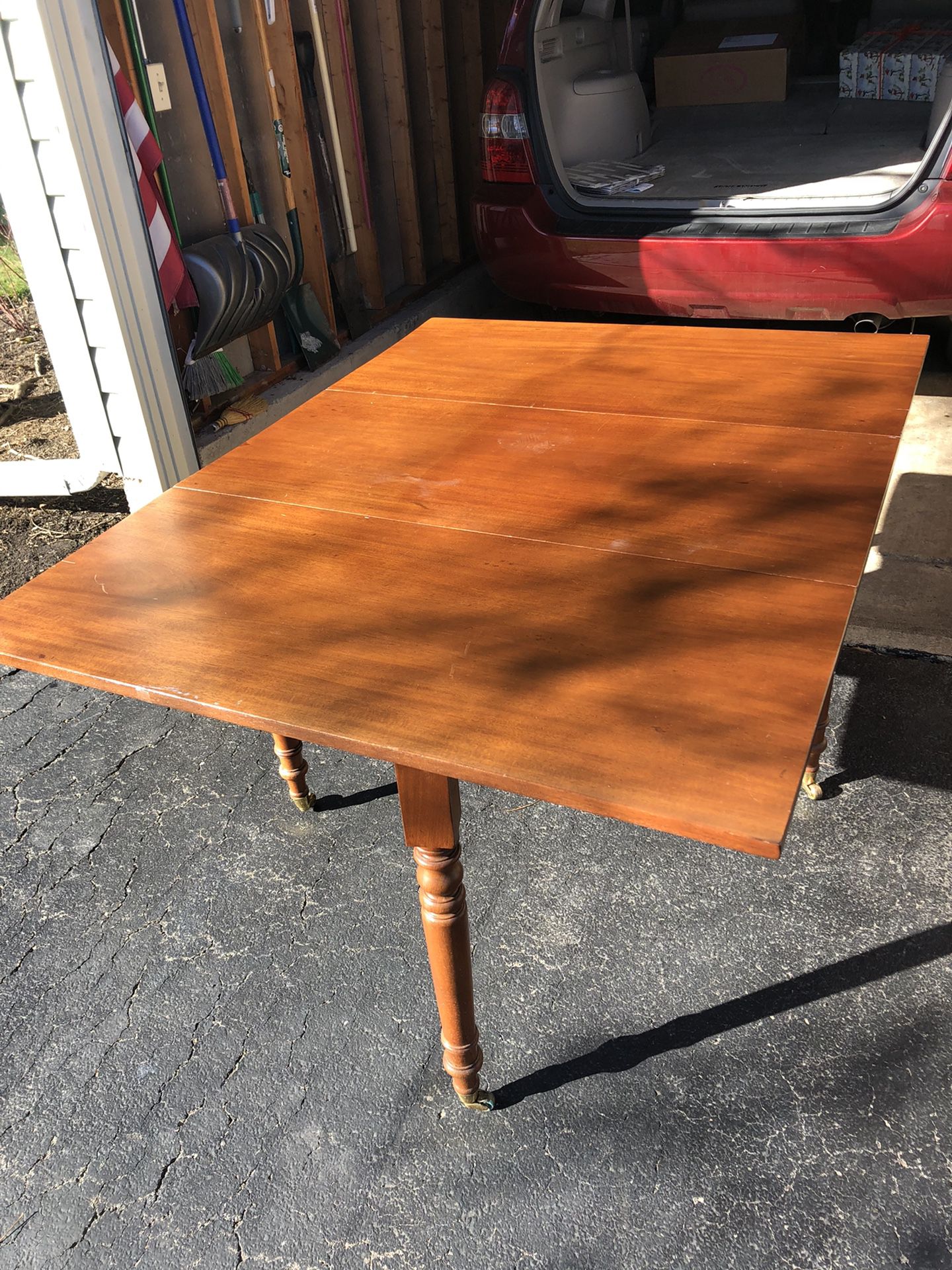 Dining room table 42 inch wide by 56 inch long, both ends fold down