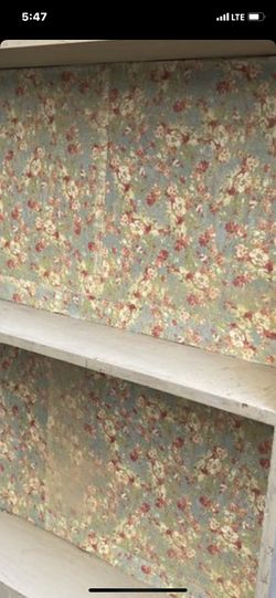 Cute Little Tan Shelf with Floral Background