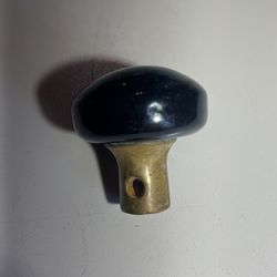 Vintage black porcelain and brass door knob