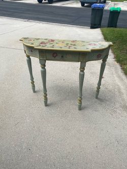 Decorative wooden table with slightly whitewashed look
