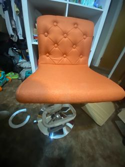 Orange Tufted Swivel Accent Chair