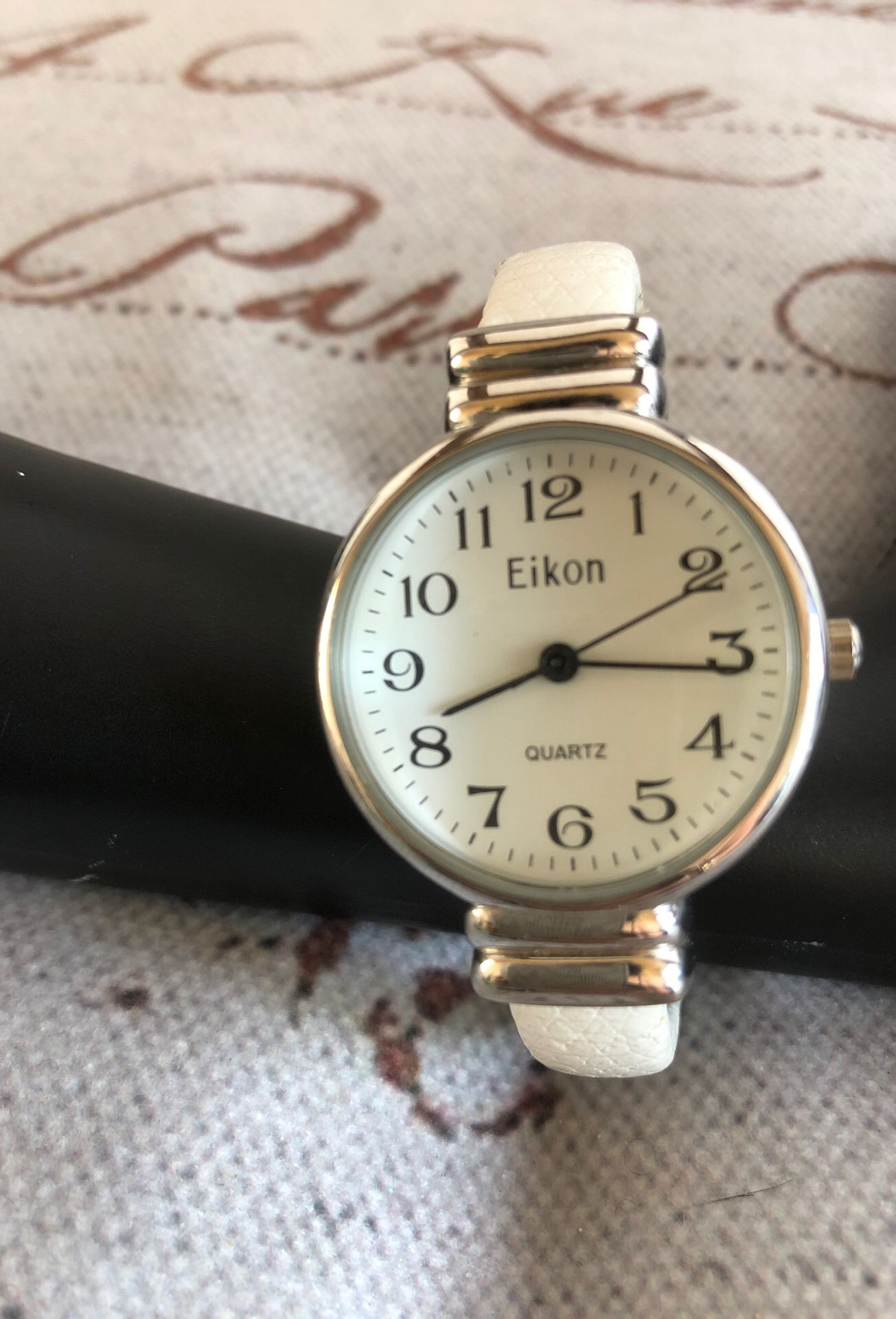Eikon watch in white and silver tone cuff