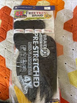 Freetress Braid 301 synthetic braiding hair by Shake-N-Go.The hair features a natural texture and is explicitly labeled as pre-stretched and non-flamm