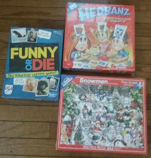 Snowmen 1000 piece puzzle, spinmaster board games Hedbanz, funny or die caption game. Choose one for $14