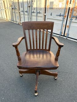 Vintage wooden office chair with casters