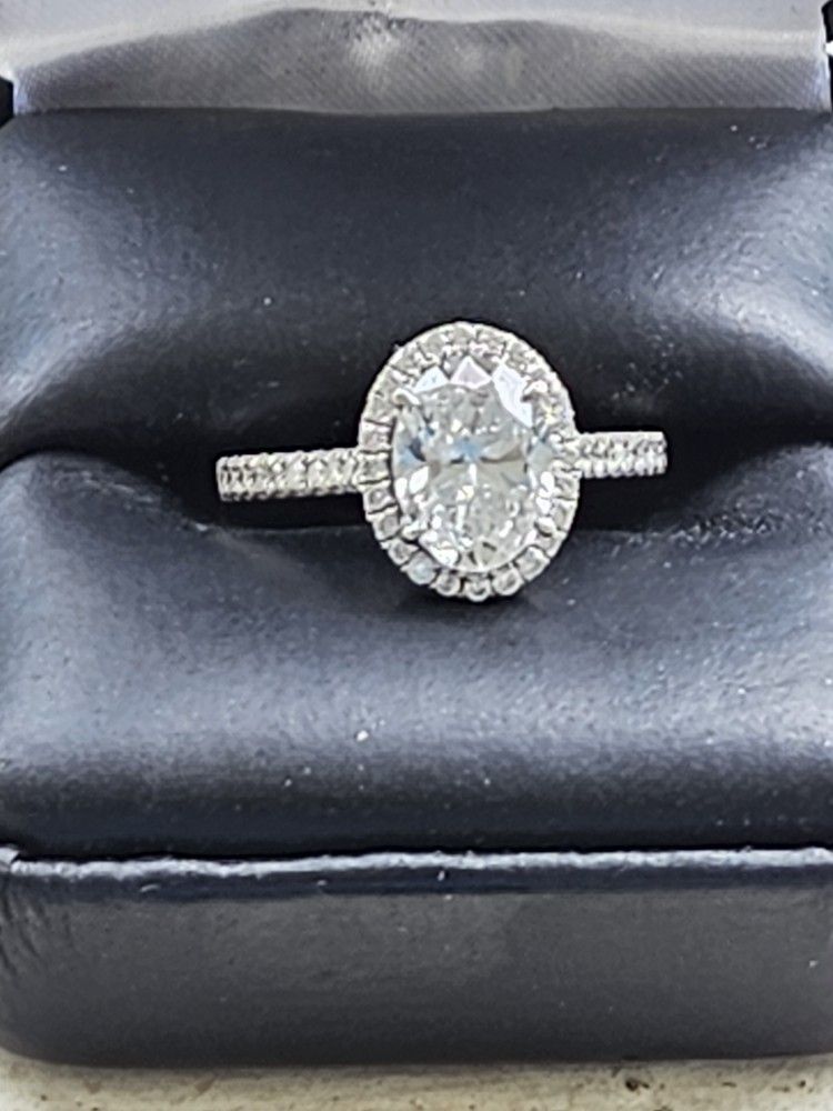 Oval Cut Diamond Halo Engagement Ring in 18 Kt White Gold