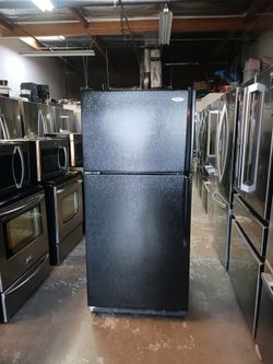 Refrigerator whirlpool 2 door in color black all working fine and 40 days warranty Delevery
