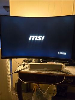 Gaming monitor with sound bar