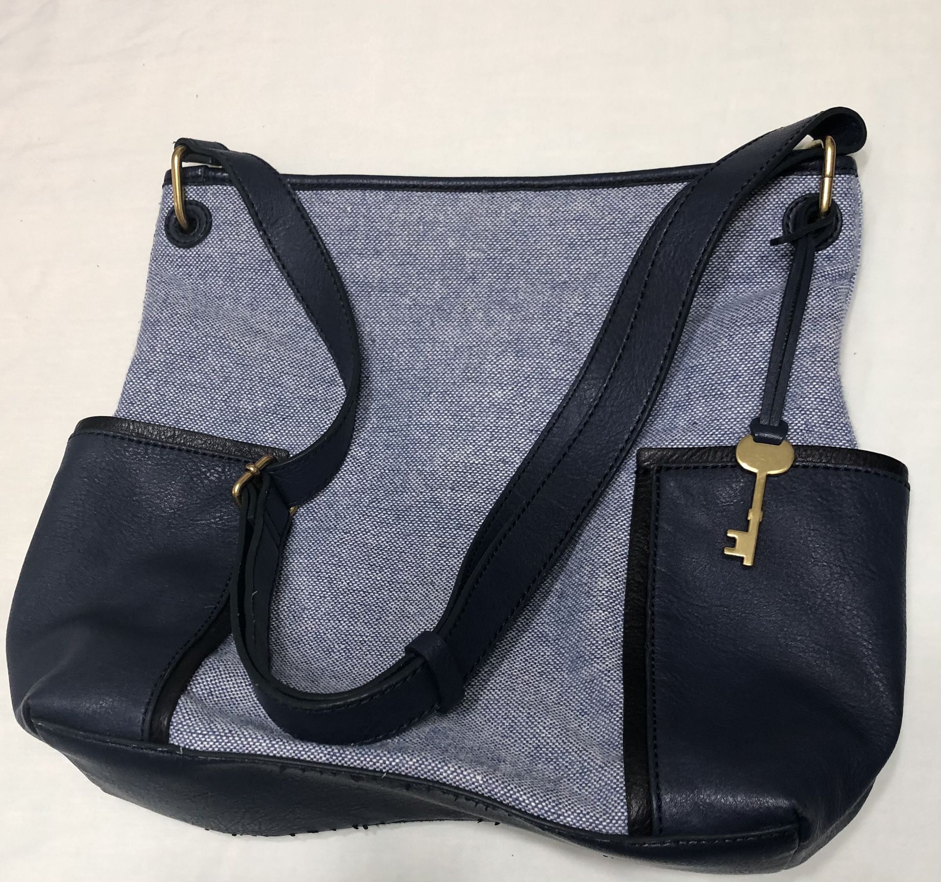 Fossil  crossbody bag two side leather pockets top magnetic buttons blue .