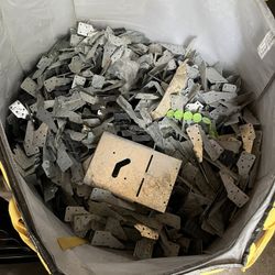 Assortment Of Hangers And Hurricane Straps And Pipe Covers For Studs