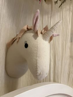 Soft felt unicorn plush wall mount from the Pillowfort brand at Target. This cream-colored decorative piece has pink