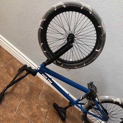 BMX bike, camo wheels, blue paint