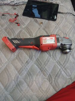 The image shows a bare-tool Milwaukee M18 FUEL 4-1/2" / 5" Angle Grinder