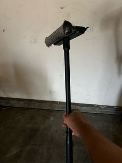 2-in-1 car window squeegee and sponge scrubber.