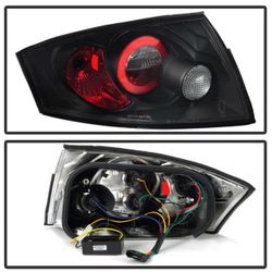 2000-2006 AUDI TT SPYDER BLACK TAILLIGHTS, BRAND NEW AND IN THE BOX.