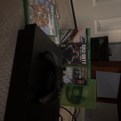 Xbox One X (1TB) with controller + games