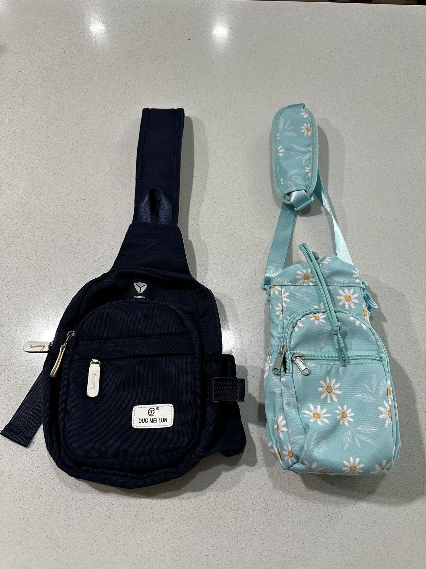 Set Of 2 Black and Blue Floral Crossbody Bags.