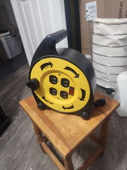  Extension Cord W/ Built In Roll Up Plus 4 Outlets