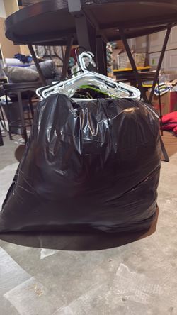 Big bag of clothes + costumes and hangars