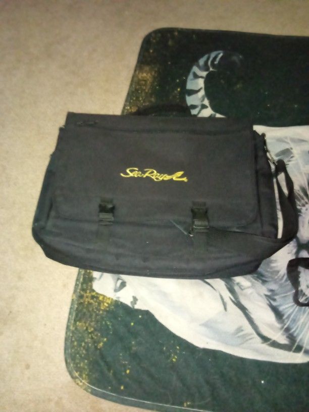 A Sea Ray Laptop Bag And A Leather
