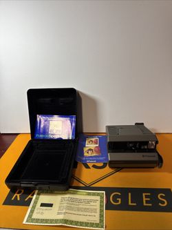 Nice Grey Polaroid Spectra System Camera With Booklet And Hard Plastic Case