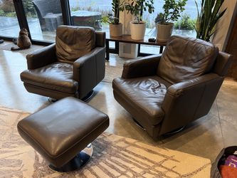 Pair of Dania leather swivel chairs with ottoman