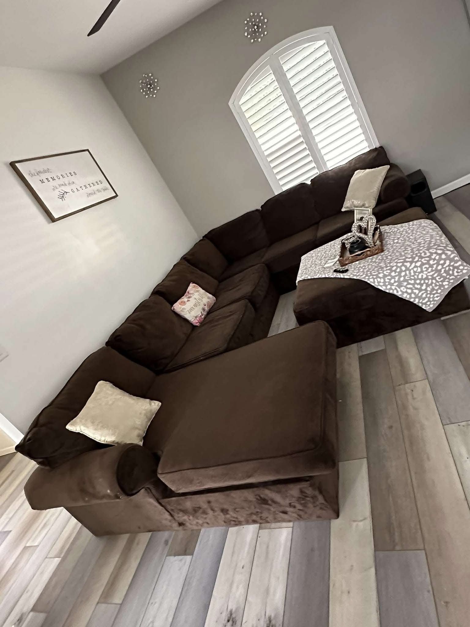 Brown sectional with ottoman