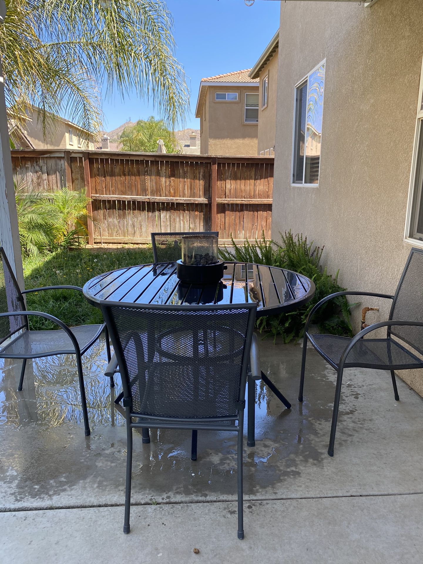 Patio table and chairs with mini fire pit