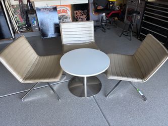 Designer swivel chairs and round table