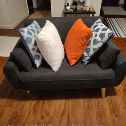 A CUTE BLUE SOFA CAN HOLD UP TO A 300_ 50 POUND PERSON