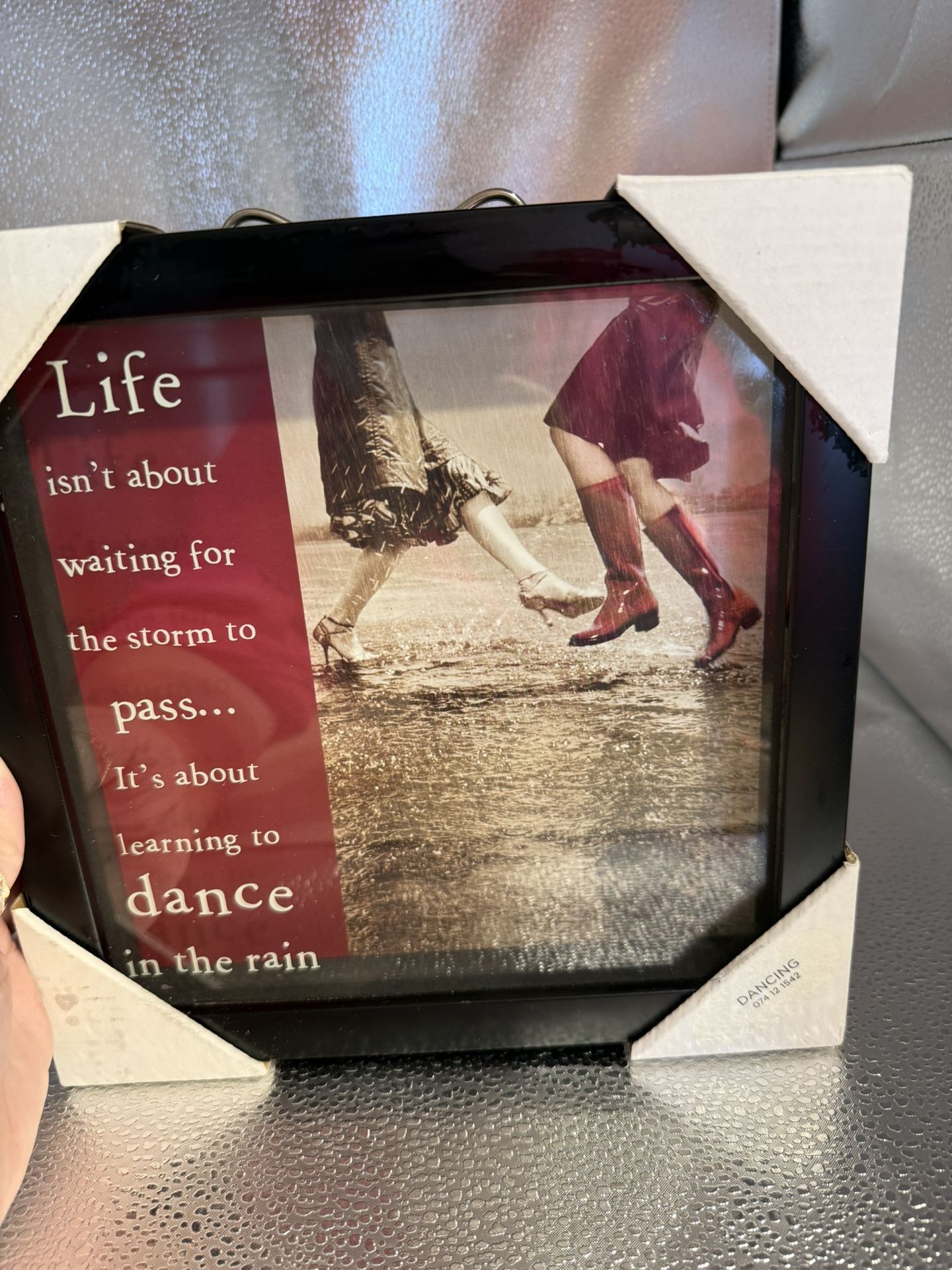 A Glass Picture With The Saying Dancing In The Rain