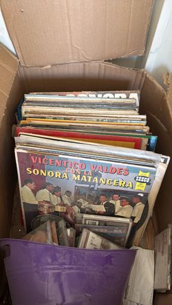 Vinyl collection including 45s, CDs and cassette tapes