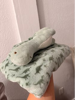 Blanket with plush toy