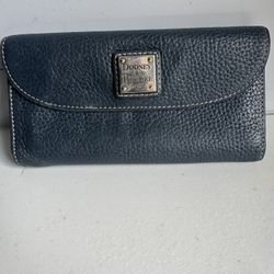 Dooney & Bourke Pebble Grain Continental Clutch Elegant navy wallet with textured design. 