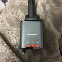 The product in the image is a SUPERONE Bluetooth car charger with an FM transmitter. 