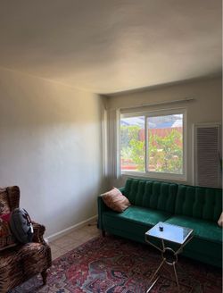 Green sofa turns into bed