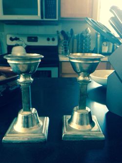 Silver colored candle holders