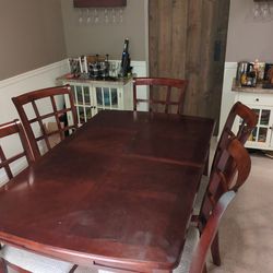 Dining room table, 6 chairs, custom padded cover, and curio!