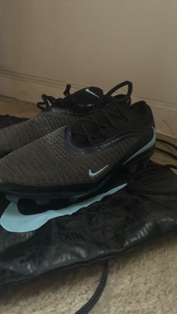 Nike Phantom 6 Elite Low soccer cleats in black with light blue logos