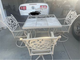 Wrought iron patio table and chairs