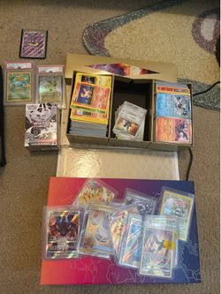 Bulk exs in top loaders, old tins, sealed card sleeves, and psa