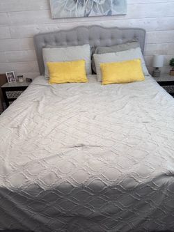 Queen bed with cloth headboard