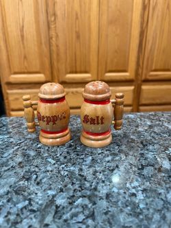 Vintage Mid-Century Wood Salt and Pepper Shakers.  Size approximately 3 inches tall.